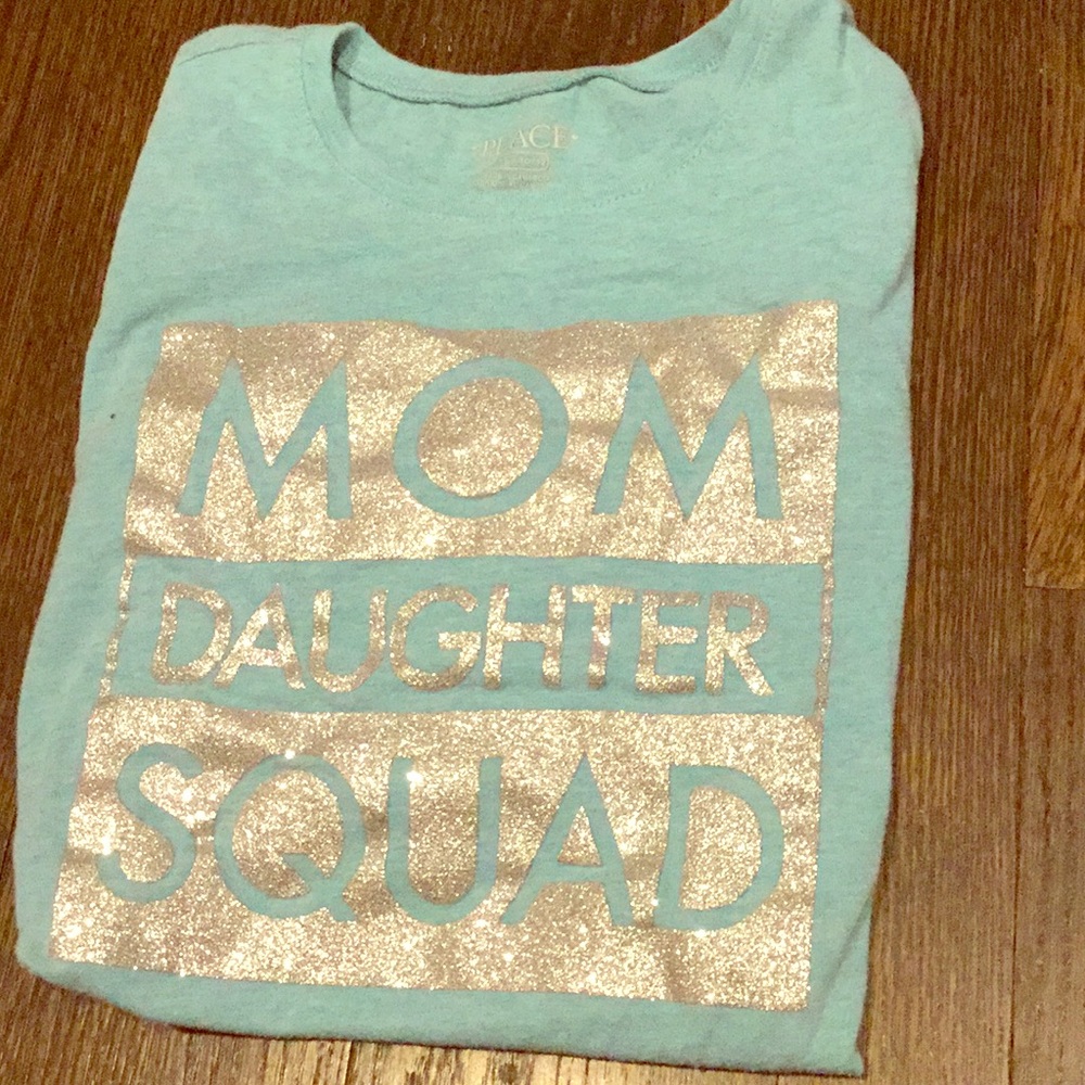 A long sleeve t-shirt with a glittery title